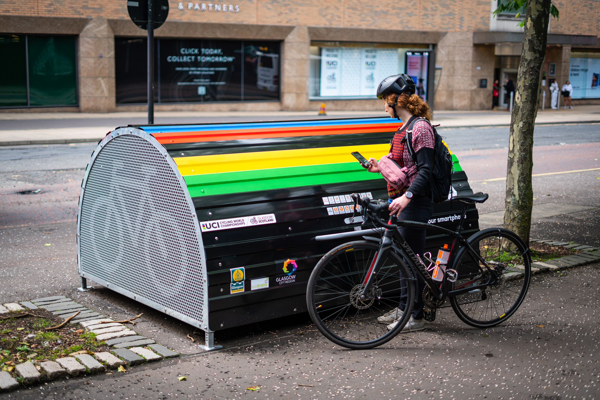 Woman with bike using smart Bikehangar