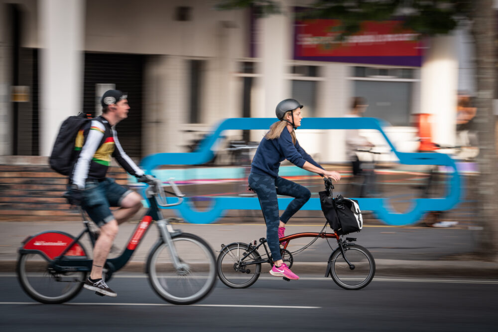 a woman and a man cycling